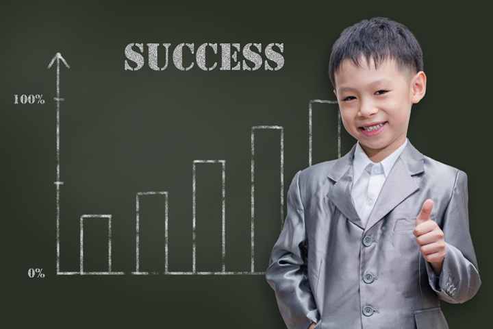 Asian businessman kid showing thumbs up